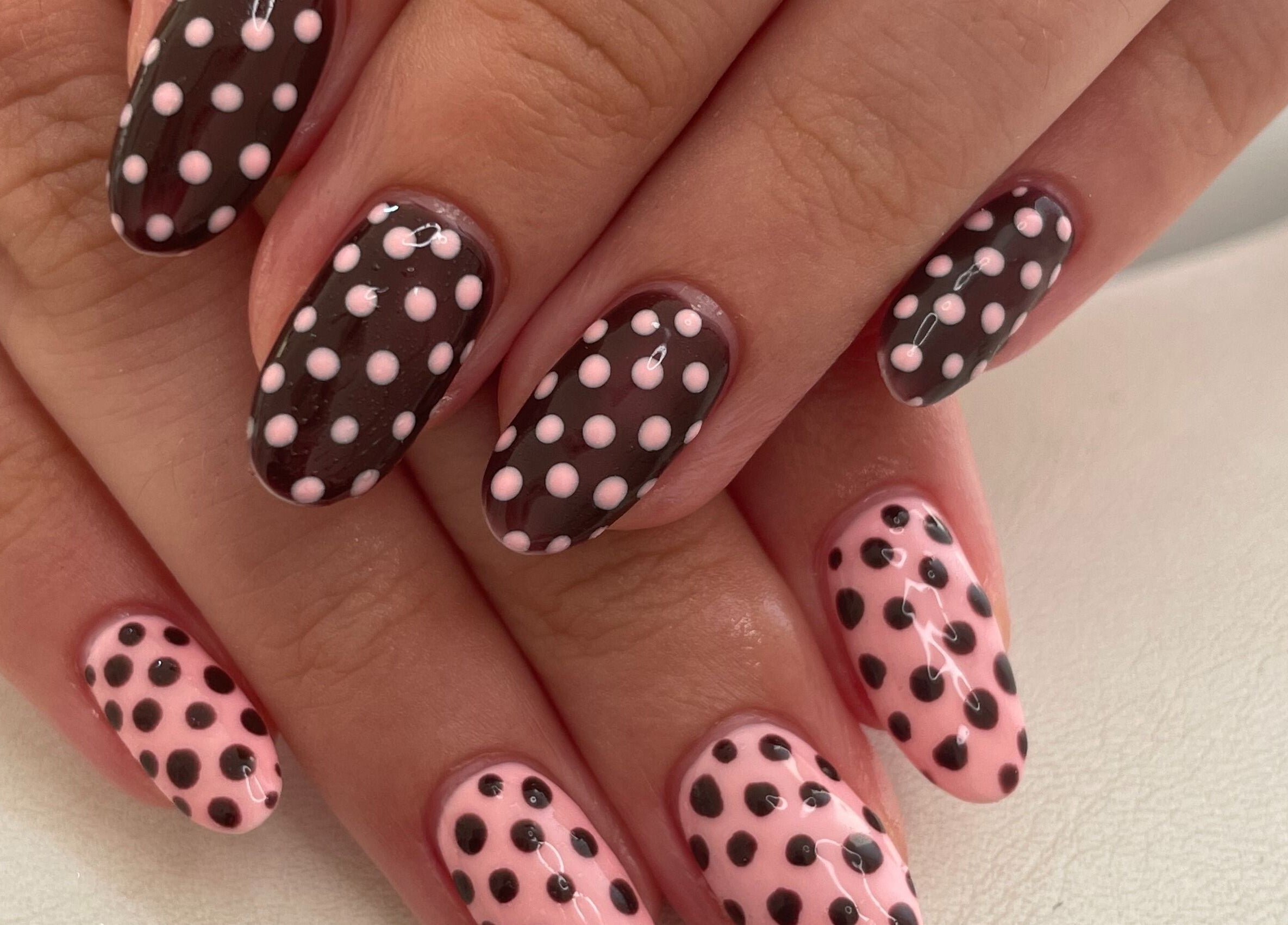 Polka dot nail art at Nails by Chloe, Marske-by-the-sea, England, GB showcasing pink and black design.