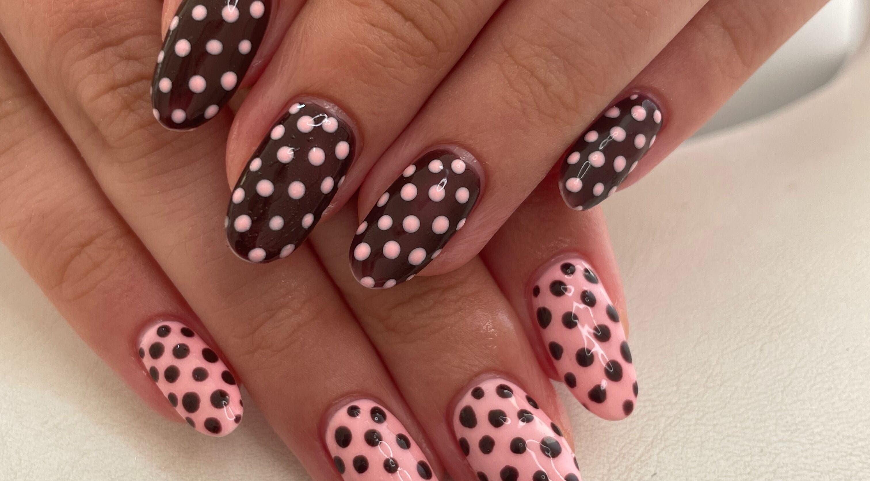 Polka dot nail art at Nails by Chloe, Marske-by-the-sea, England, GB showcasing pink and black design.
