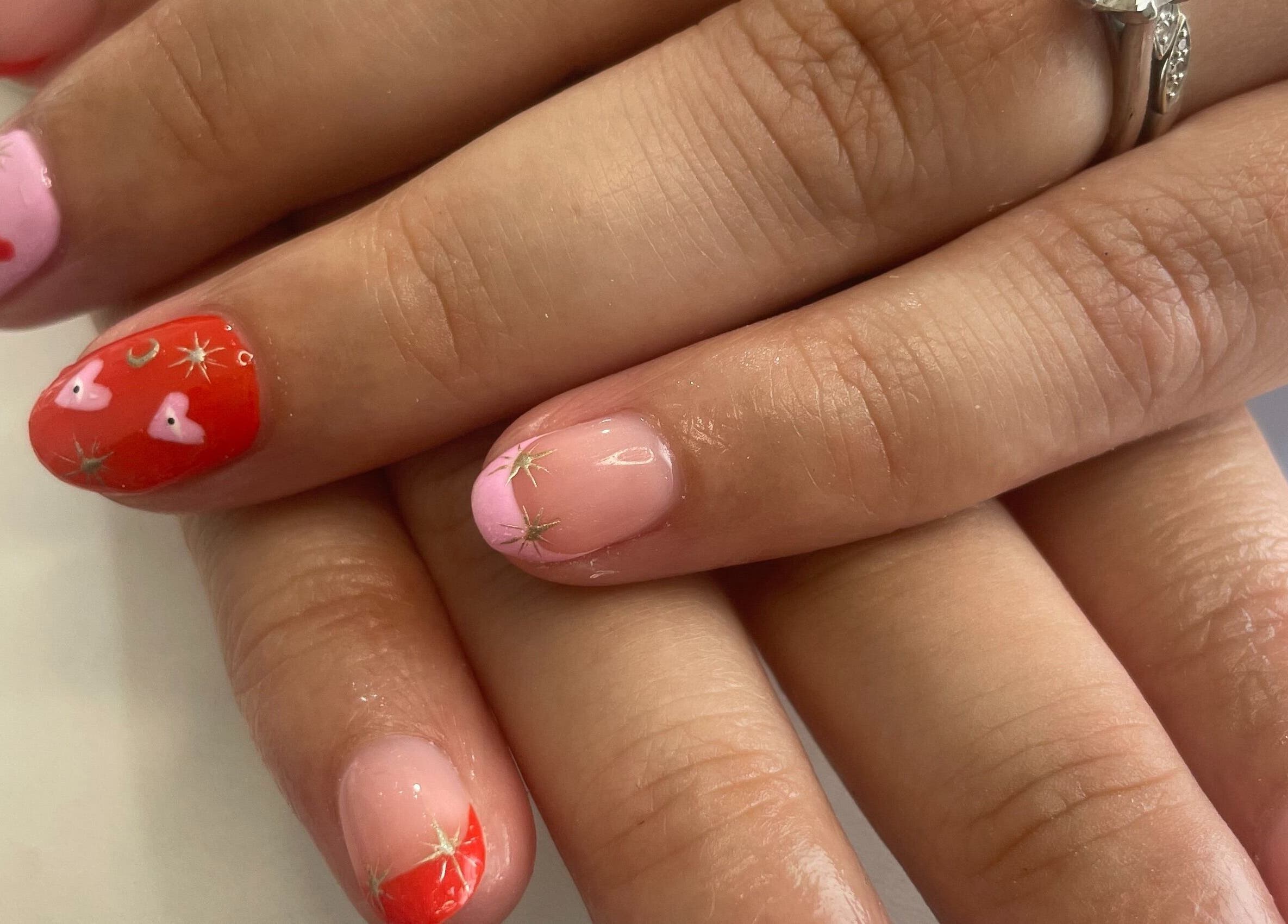 Stylish nail art with hearts and stars at Nails by Chloe, Marske-by-the-sea, England, GB.