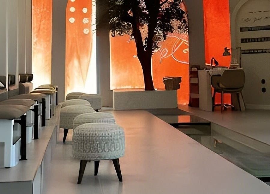 Elegant interior of Notes Salon in Dammam, Eastern Province, SA featuring plush seating and ambient lighting.