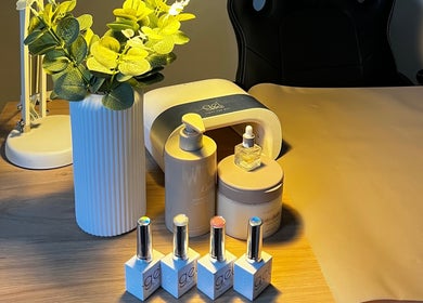 Manicure station at Lumiere Beauty, Cambridge, England, GB with nail polishes and plant decor.