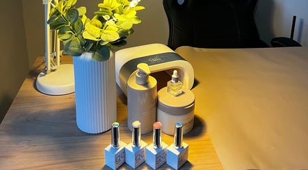 Manicure station at Lumiere Beauty, Cambridge, England, GB with nail polishes and plant decor.