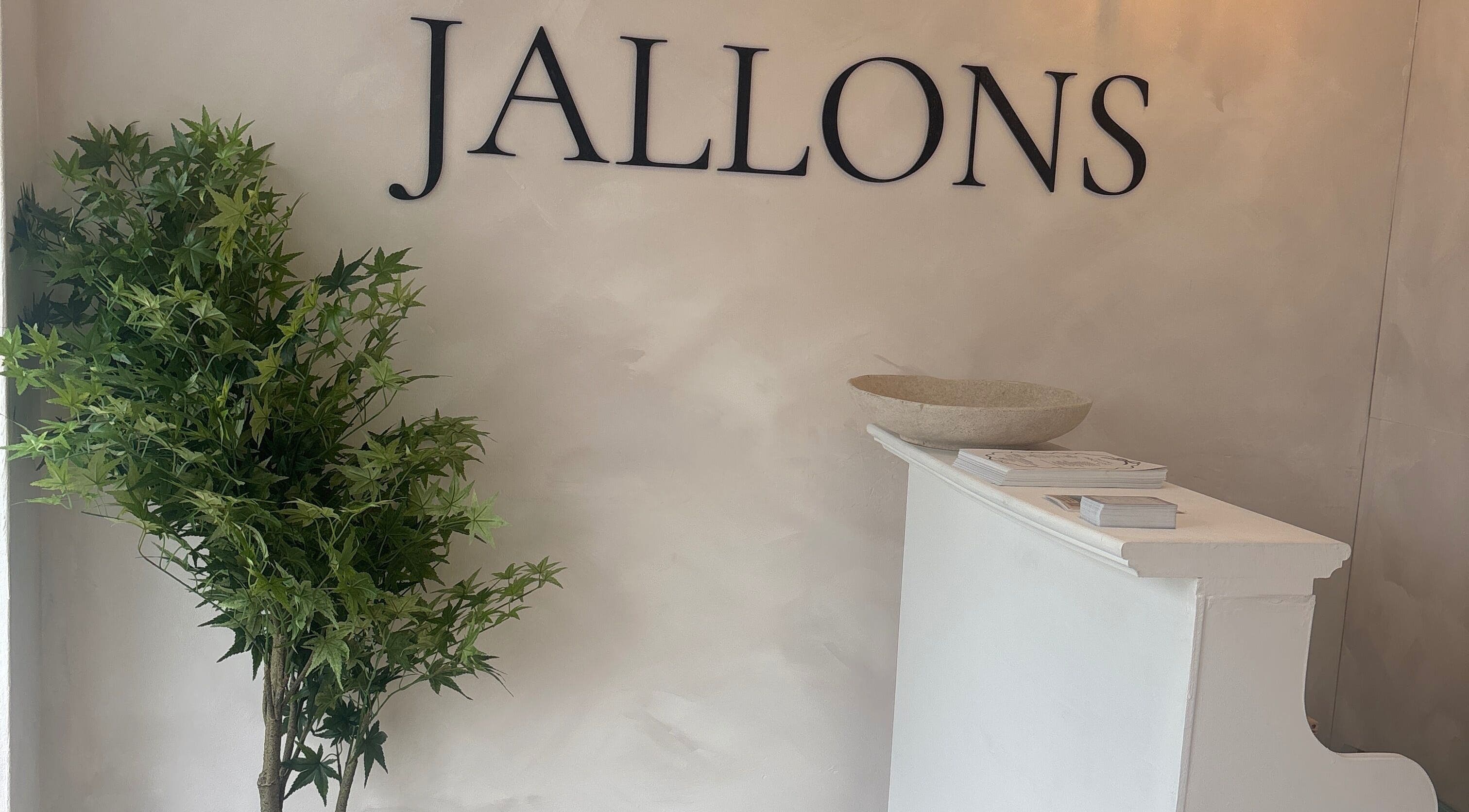 Elegant reception desk at Kari Beauty in Clifton, England, GB, adorned with greenery and modern decor.