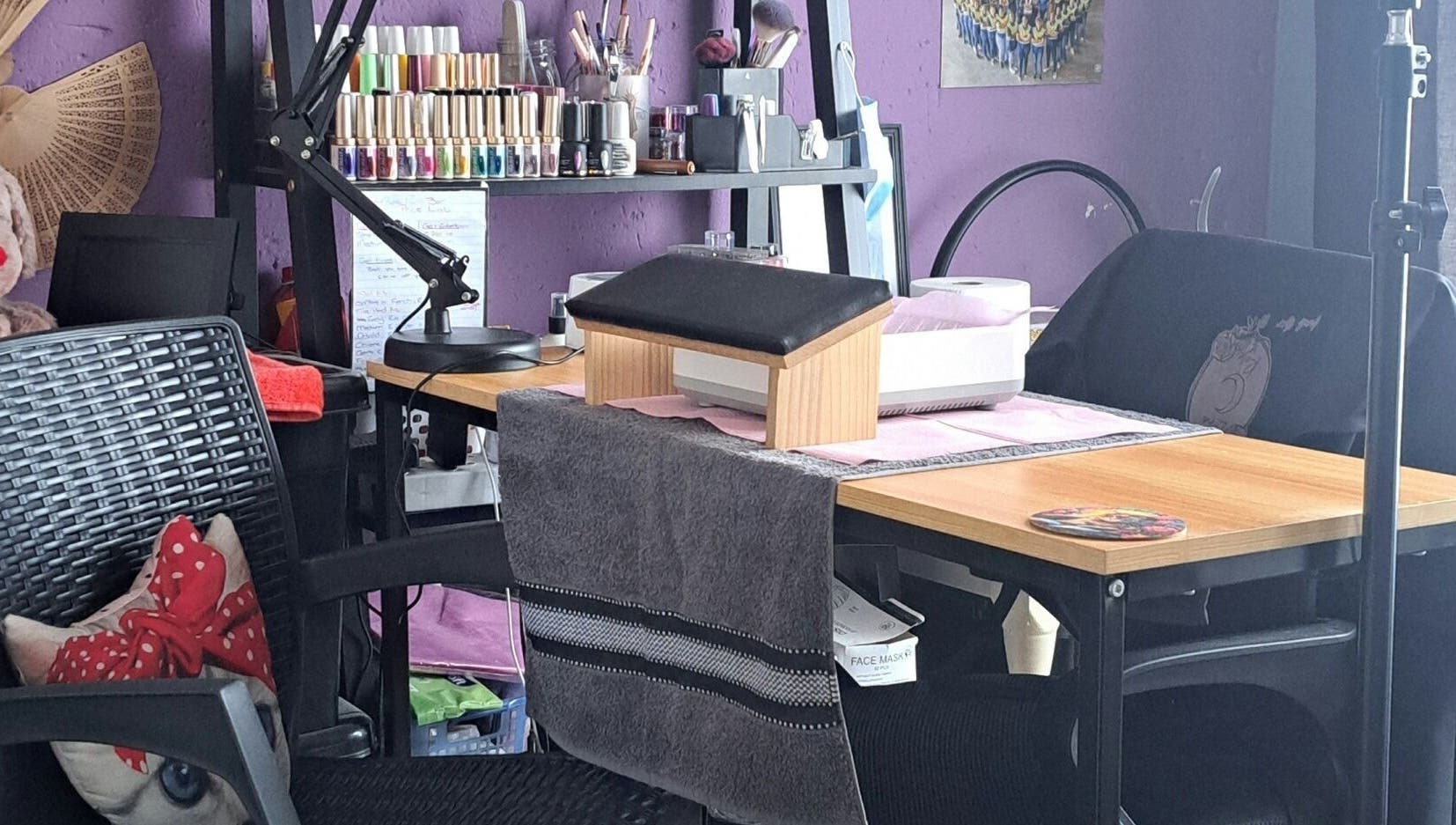 Cozy interior of Luna Rose Nail Bar in Benoni, Gauteng, ZA, showcasing nail polish and manicure station.