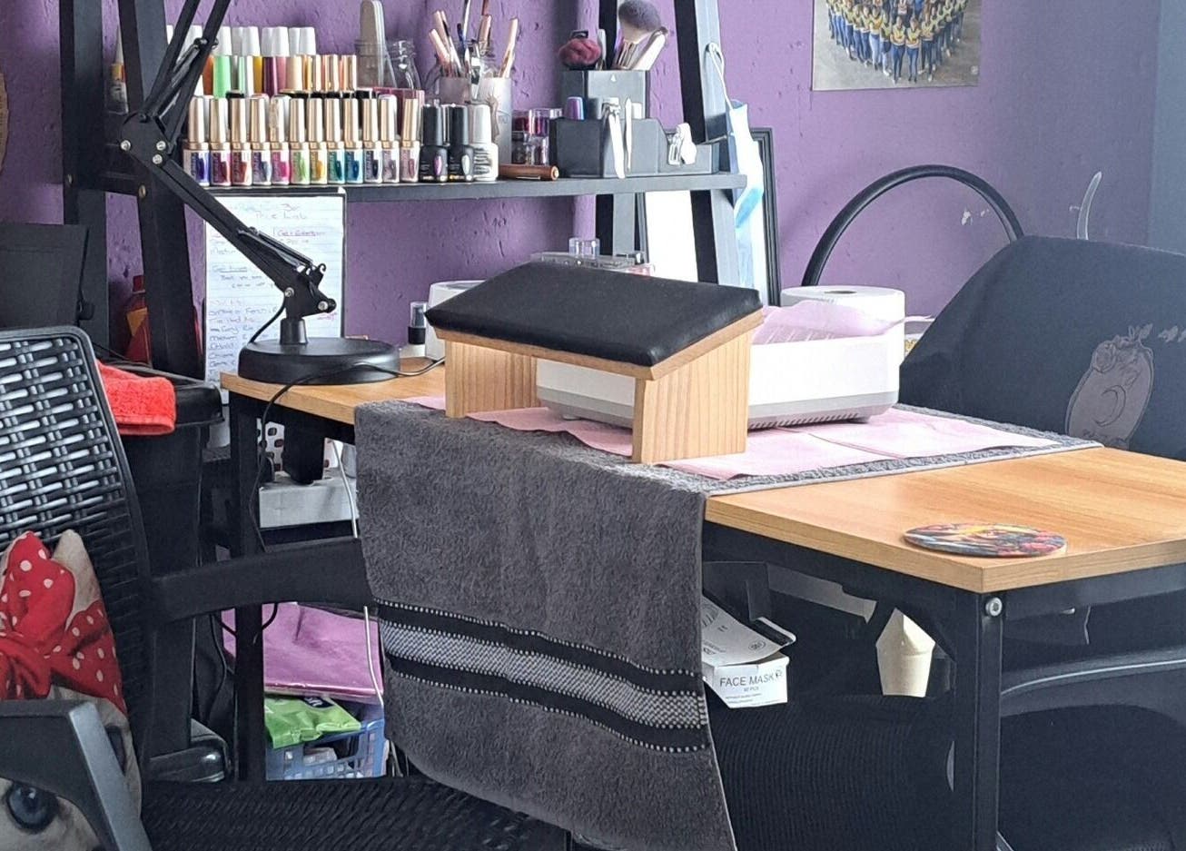 Cozy interior of Luna Rose Nail Bar in Benoni, Gauteng, ZA, showcasing nail polish and manicure station.