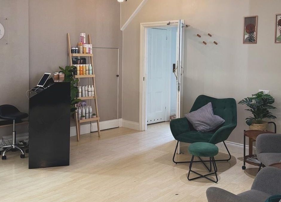 Niamh Monaghan Hair lounge in Norwich, England, GB, featuring modern decor and styling products display.