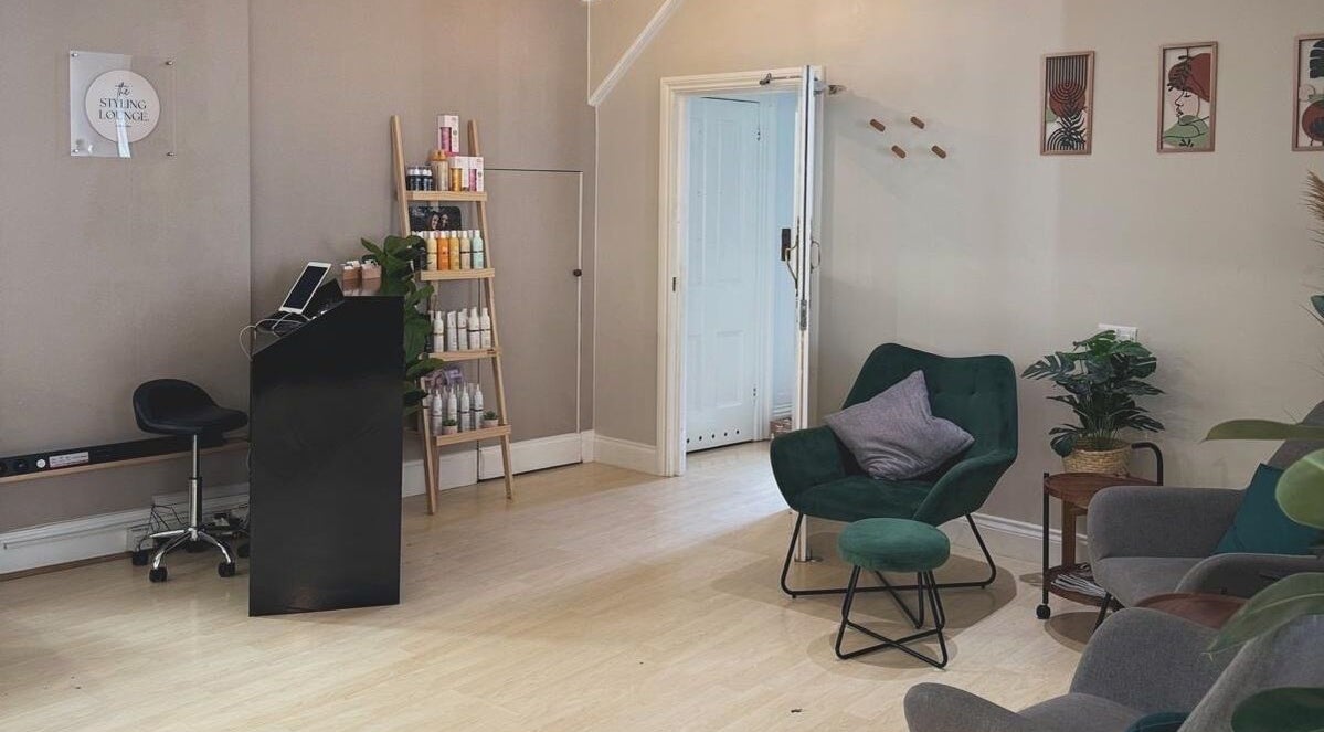 Niamh Monaghan Hair lounge in Norwich, England, GB, featuring modern decor and styling products display.
