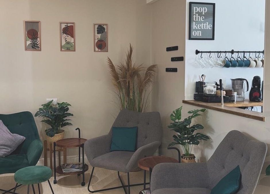 Stylish seating area at Niamh Monaghan Hair, Norwich, England, GB, with plush chairs and modern decor.