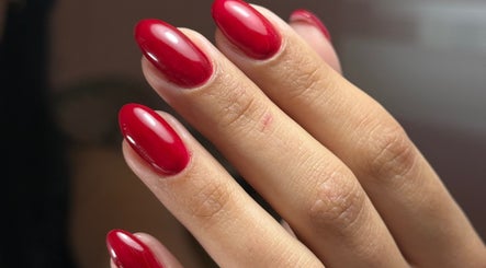 Vibrant red manicured nails at Delmarrr.studio, Toa alta, Bayamón, PR, showcasing expert nail art.
