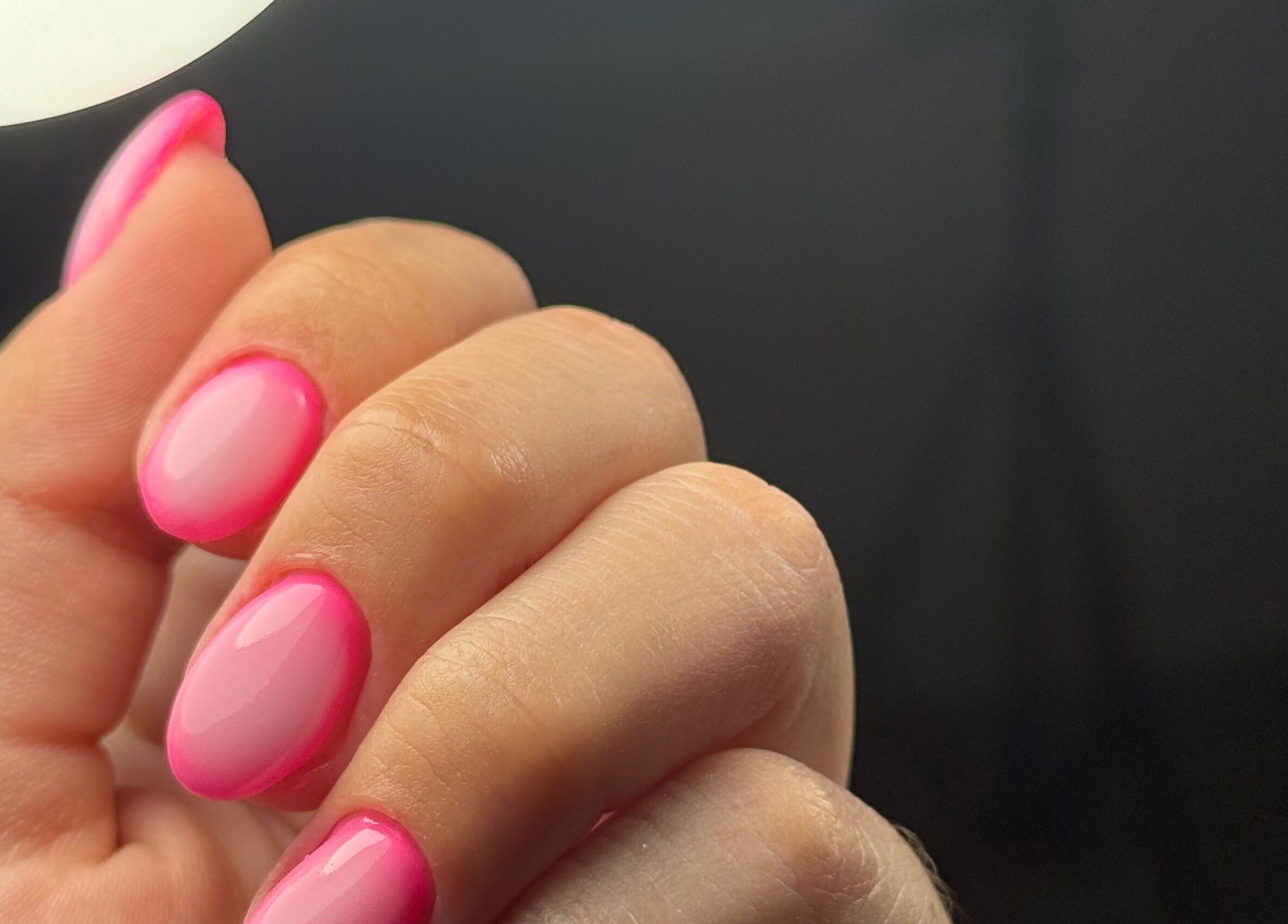 Close-up of vibrant pink manicured nails at Delmarrr.studio, Toa alta, Bayamón, PR.