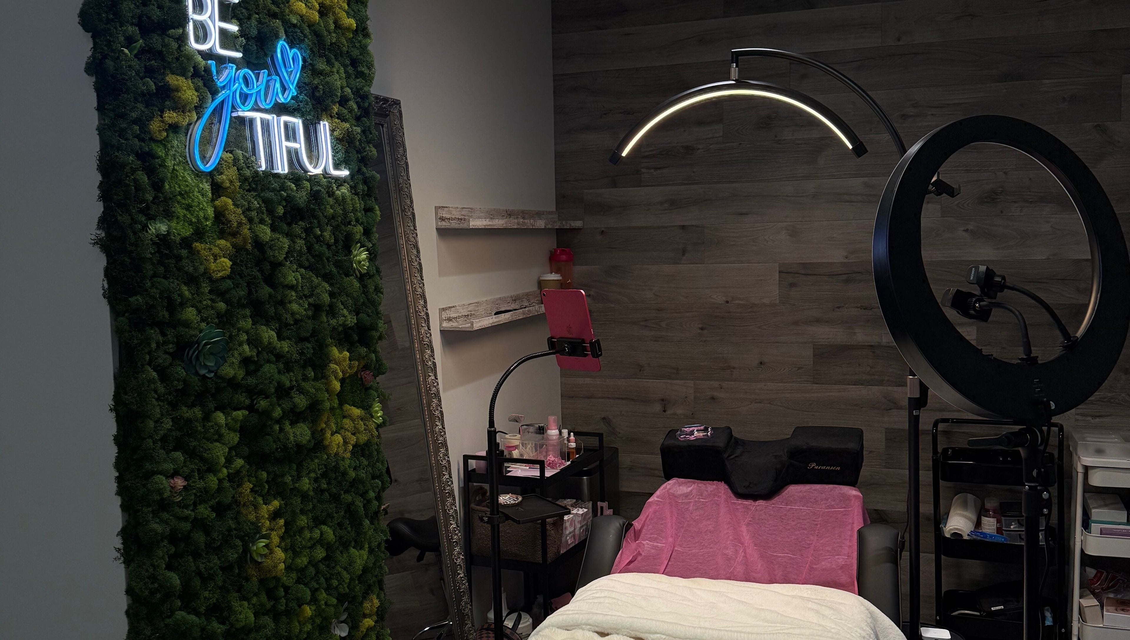 Serene beauty room at Lash Shawty West Broadway, Vancouver, British Columbia, CA with lush greenery decor.