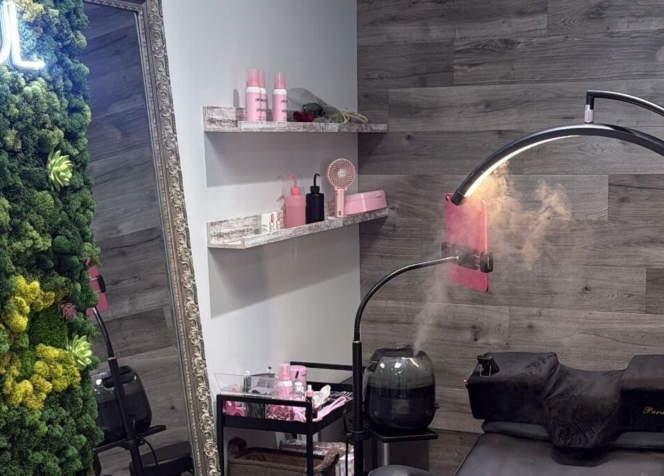 Relaxing beauty room at Lash Shawty West Broadway in Vancouver, British Columbia, CA with lush green decor.