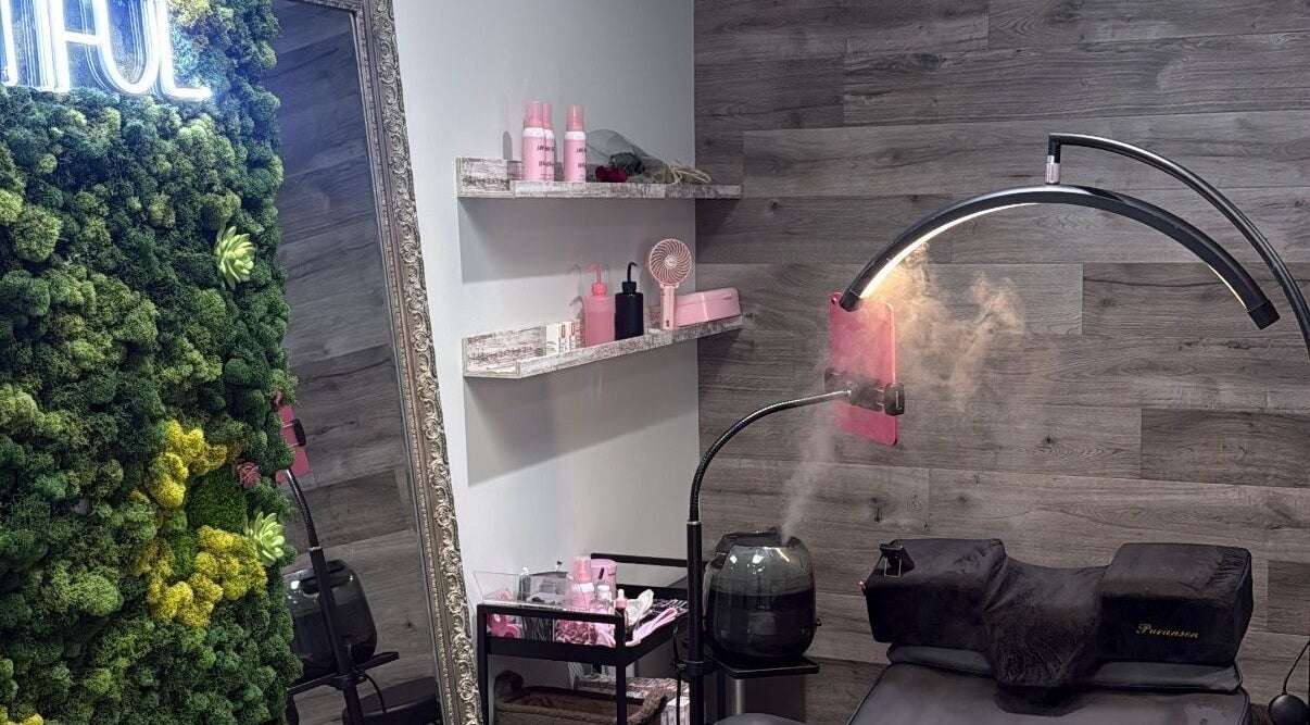 Relaxing beauty room at Lash Shawty West Broadway in Vancouver, British Columbia, CA with lush green decor.