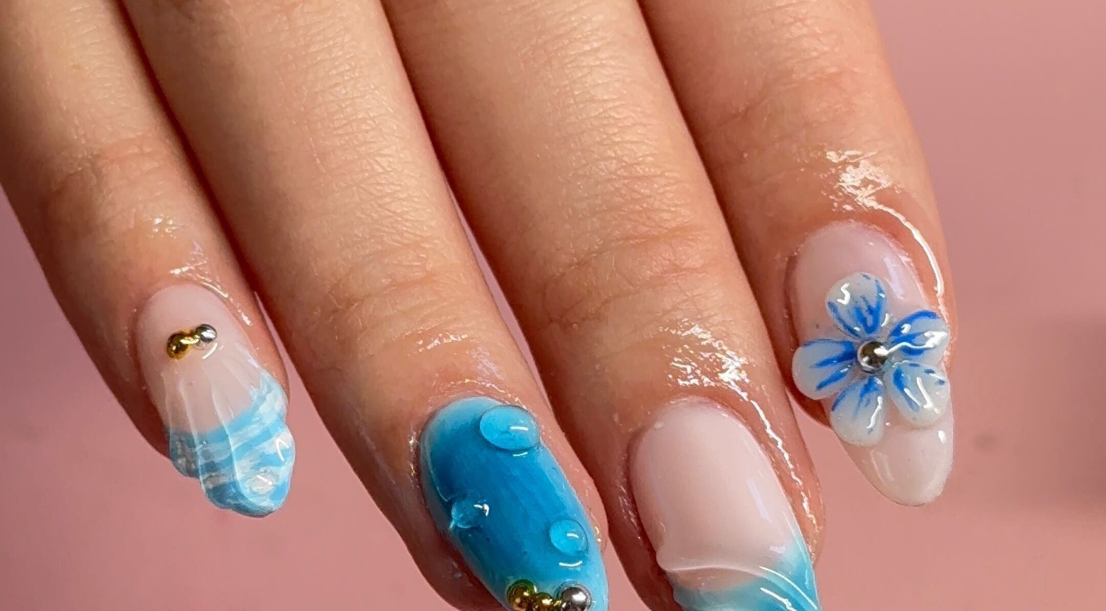 Elegant blue floral nail art at BeaNailTech in Vancouver, British Columbia, CA. Perfect for any occasion.