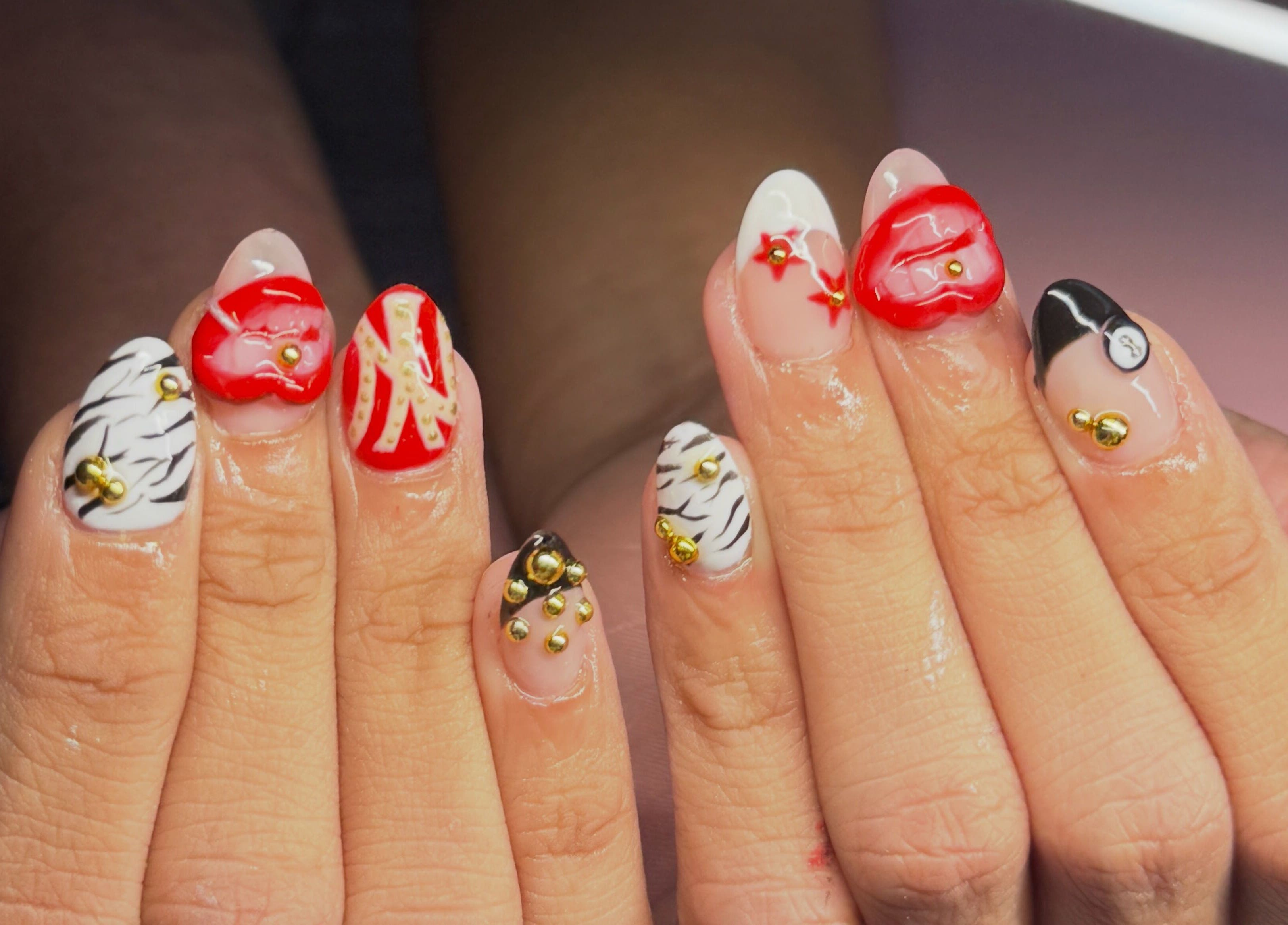 Stylish nail art at BeaNailTech in Vancouver, British Columbia, CA, featuring intricate designs and bold colors.