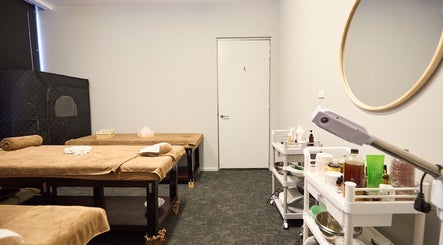 Relaxing massage room at Healix Spa & Massage Therapy, St Leonards, New South Wales, AU with cozy treatment tables.