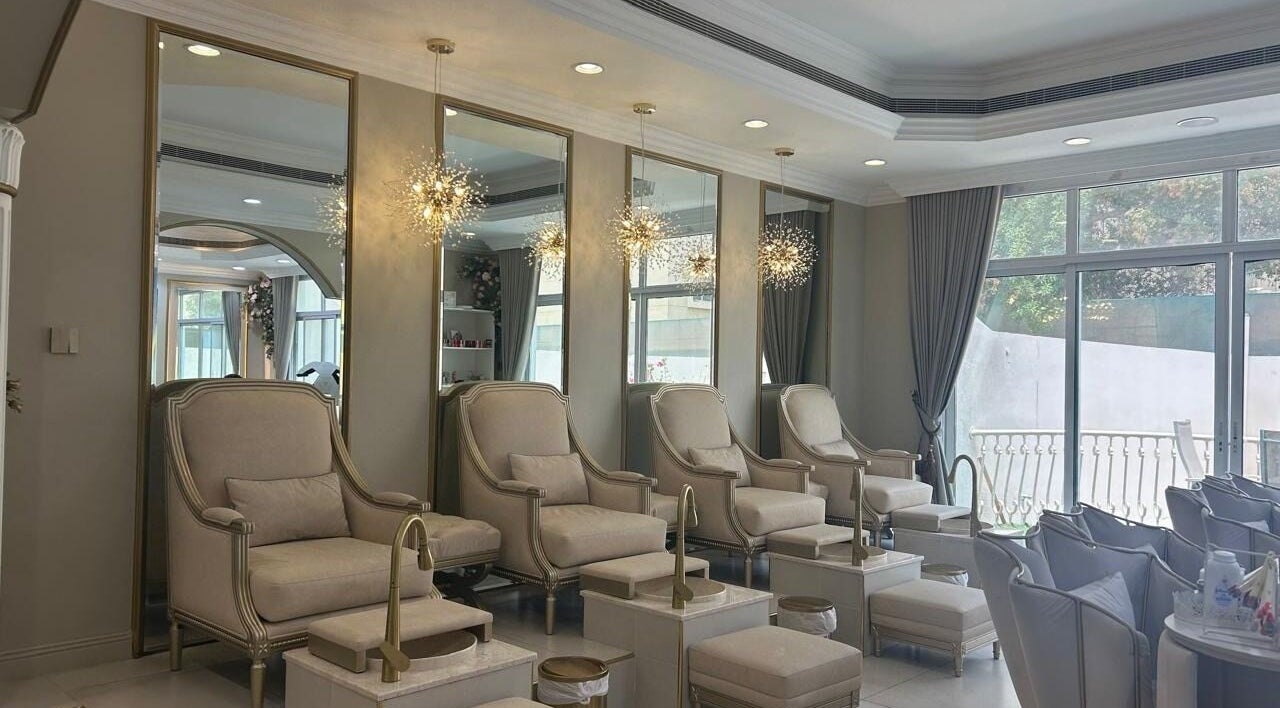 Luxurious seating area at Dolce Villa Beauty Salon, Dubai, Dubai, AE with plush chairs and elegant decor.