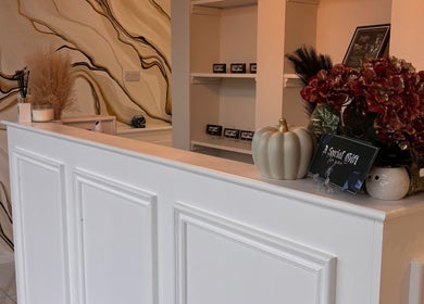 Reception desk at Beautybyanna Jane, Leyland, England, GB with elegant decor and artistic wall design.