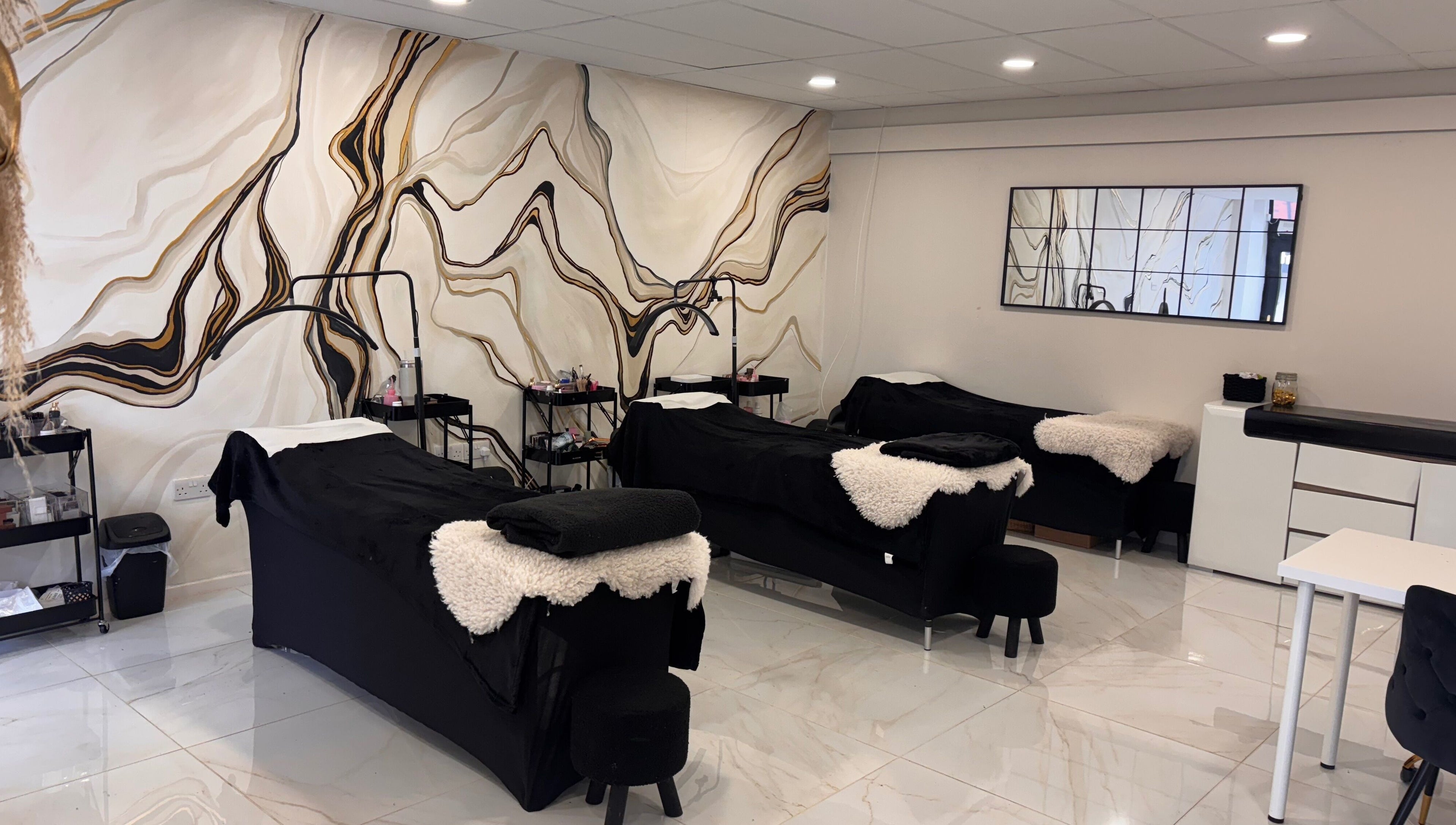 Luxury treatment room at Beautybyanna Jane, Leyland, England, GB, with elegant marble wall design.