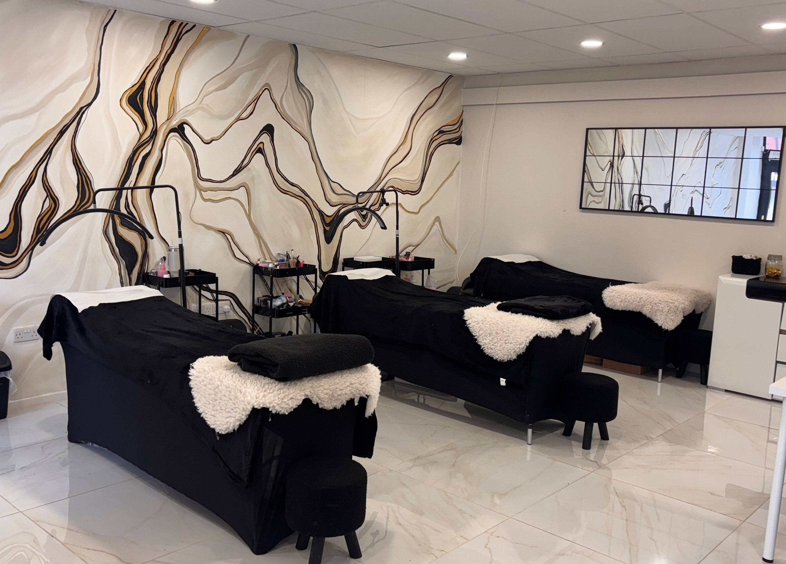 Luxury treatment room at Beautybyanna Jane, Leyland, England, GB, with elegant marble wall design.