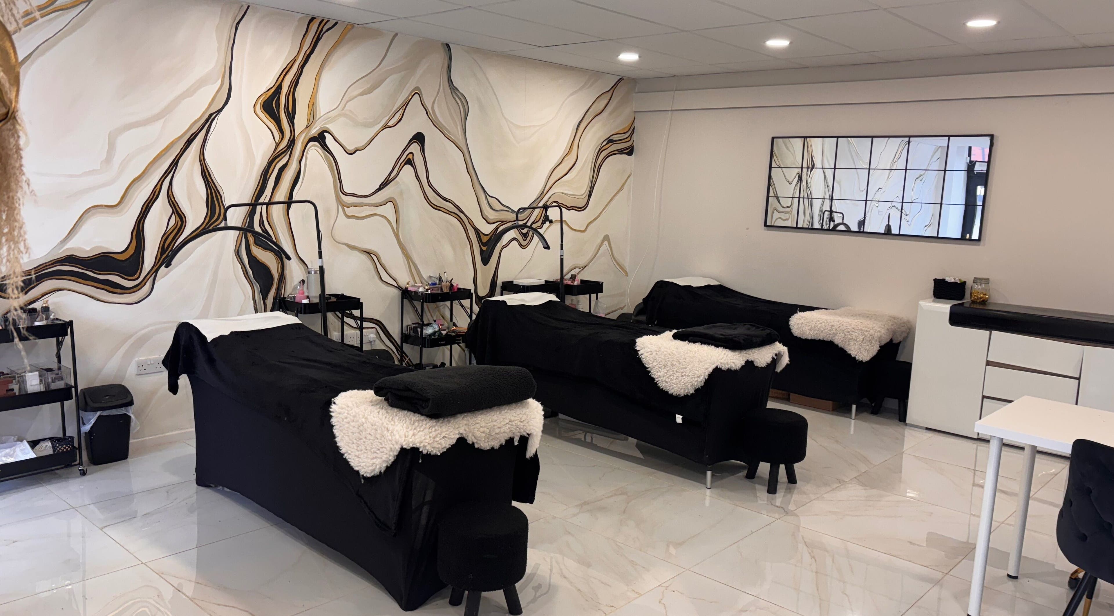 Luxury treatment room at Beautybyanna Jane, Leyland, England, GB, with elegant marble wall design.