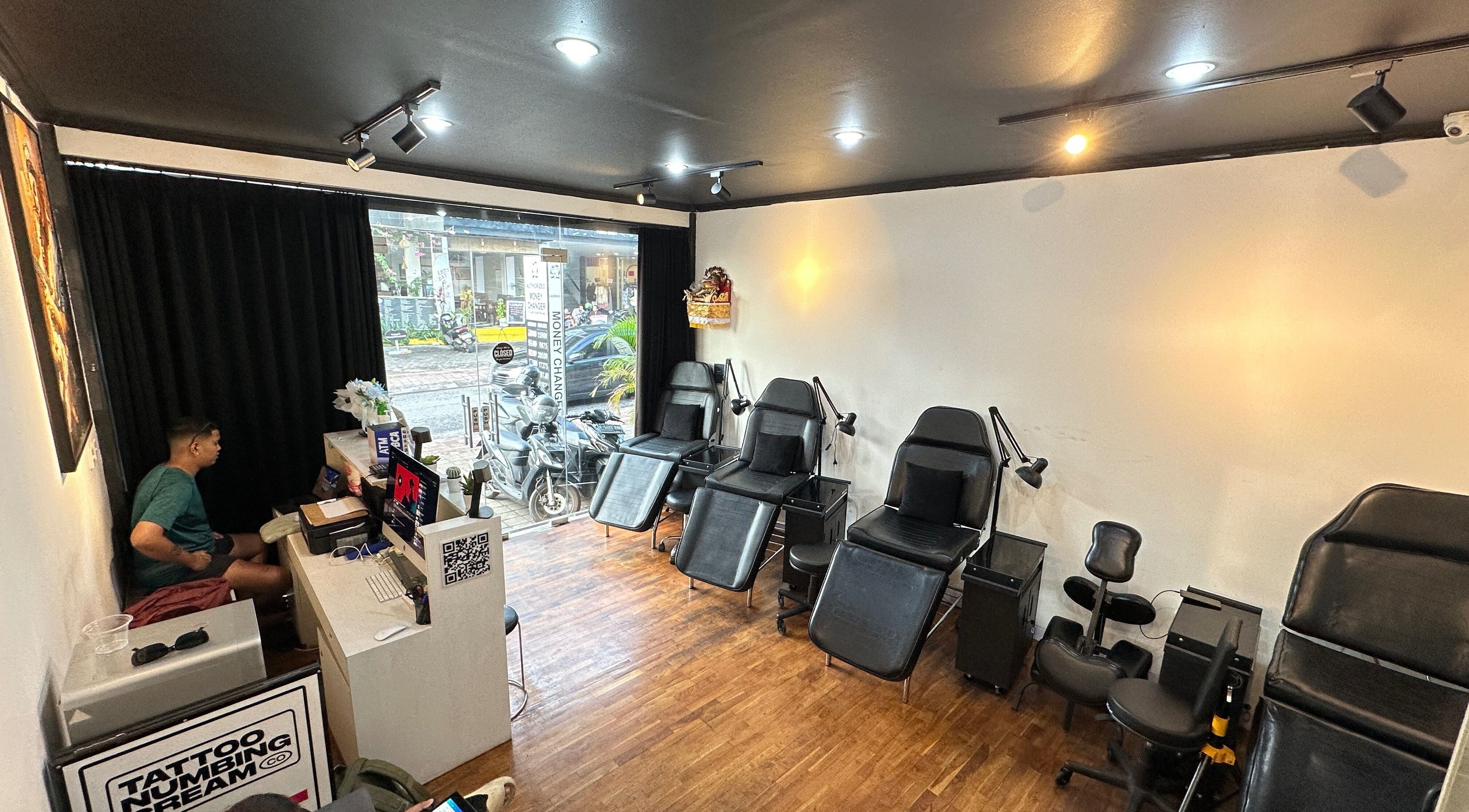 Cozy interior of Timeless Ink tattoo studio in Bali, Bali, ID with modern black chairs and welcoming ambiance.