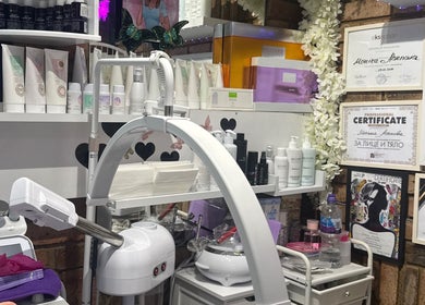 Monica’s Beauty Lounge treatment room featuring products and certificates in London, England, GB.