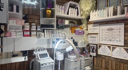 Beauty product display at Monica’s Beauty Lounge, London, England, GB with certificates and treatment devices.