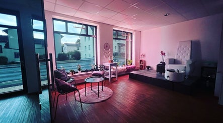 Inviting and serene interior of The Labb, Pressath, Bayern, DE featuring plush seating and large windows.