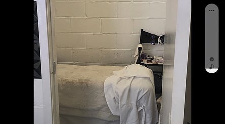 Relaxing treatment room at Purebrowslashbar in Sittingbourne, England, GB, featuring a plush bed and neat setup.
