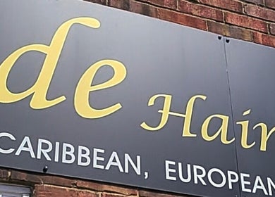 Signage of Purebrowslashbar beauty salon in Sittingbourne, England, GB with elegant lettering.