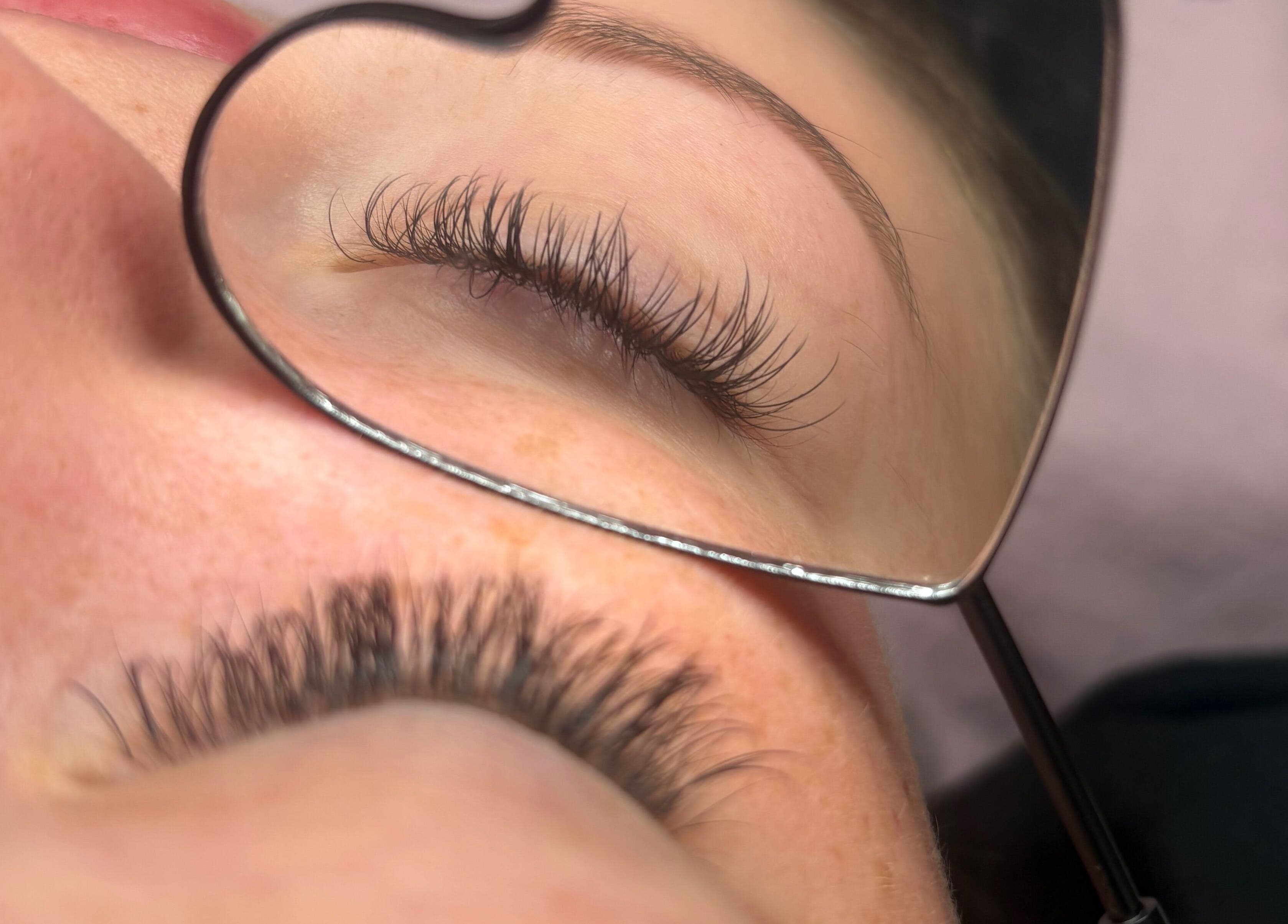 Close-up of eyelash extensions in a heart-shaped mirror at lishas_lashes, Londonderry, Northern Ireland, GB.