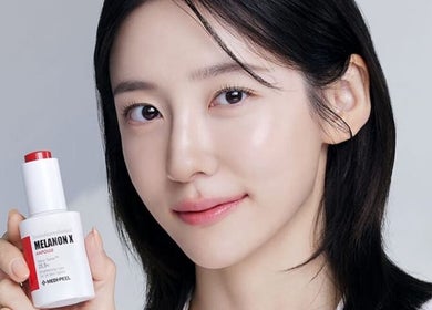 Client showcases clear skin and product at Homebush Beauty Skin Care, Homebush, New South Wales, AU.