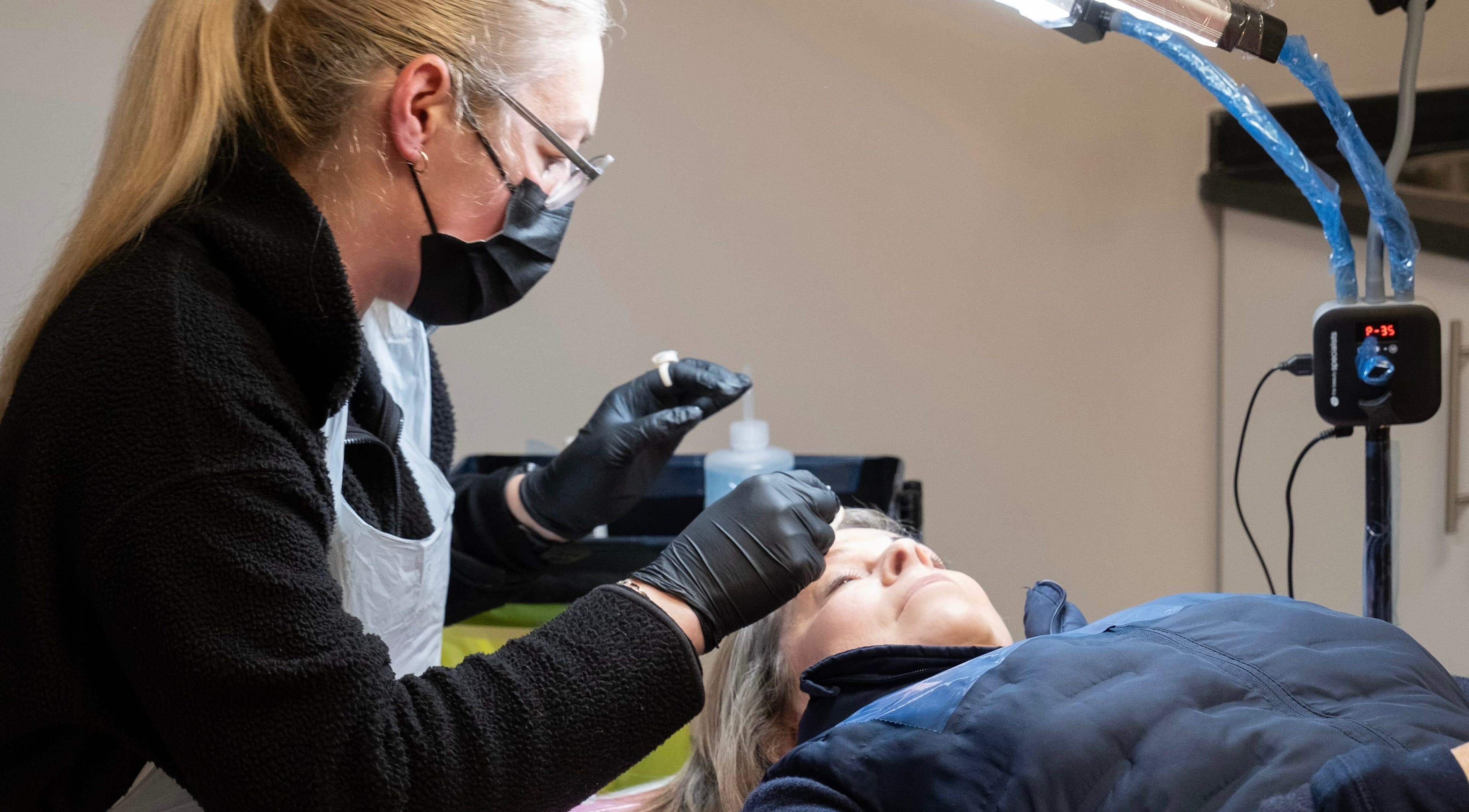 Arcus SPMU Ltd technician performing treatment in Wallsend, England, GB, ensuring client relaxation.