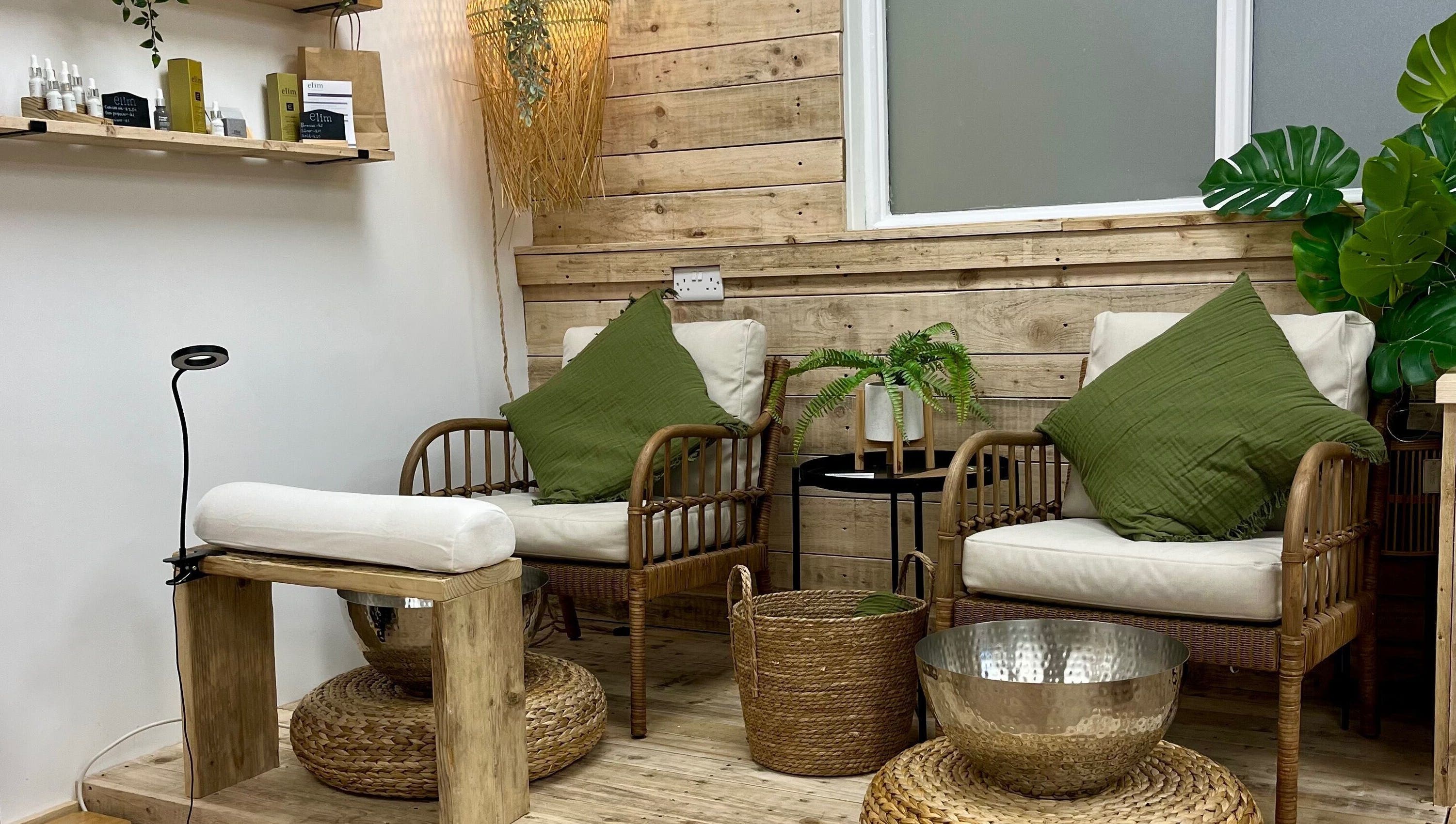 Inviting seating area at Perfectpedi With Frenchies, Pembroke, Cymru, GB with cozy chairs and greenery.