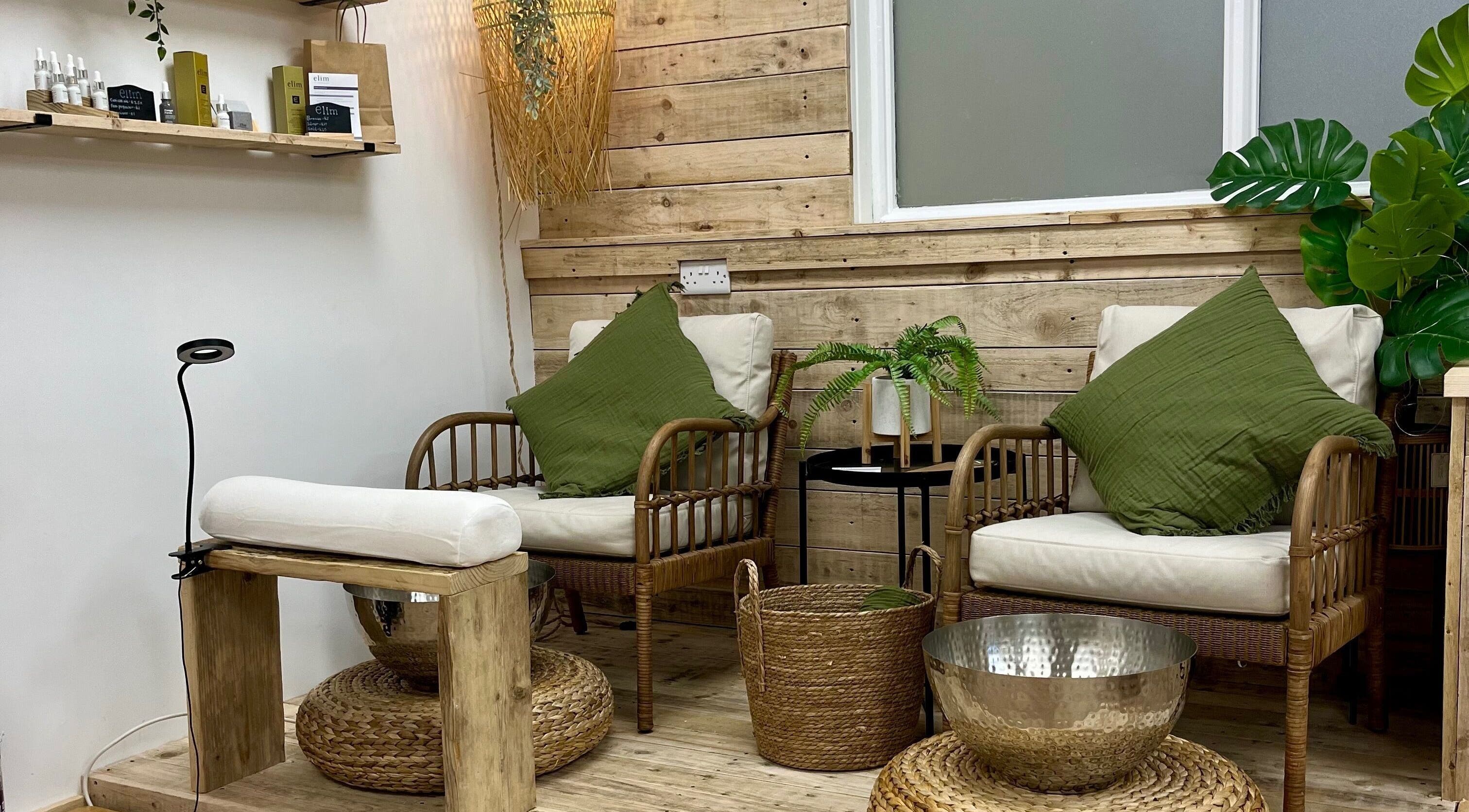 Inviting seating area at Perfectpedi With Frenchies, Pembroke, Cymru, GB with cozy chairs and greenery.