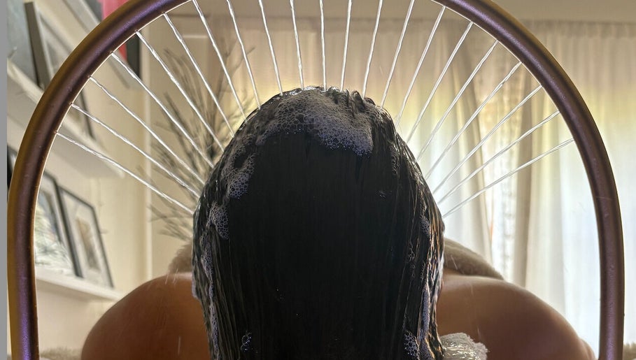 Relaxing hair spa treatment at Glow Beauty, Elgin, Scotland, GB. Luxurious bubbles and comfort surround the client.