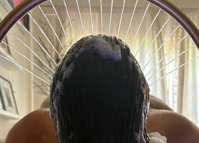 Relaxing hair spa treatment at Glow Beauty, Elgin, Scotland, GB. Luxurious bubbles and comfort surround the client.