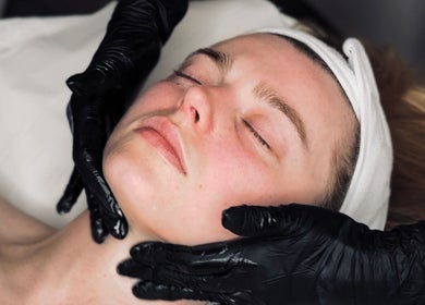 Facial treatment in progress at Glow Beauty in Elgin, Scotland, GB. Customer relaxes during a rejuvenating session.