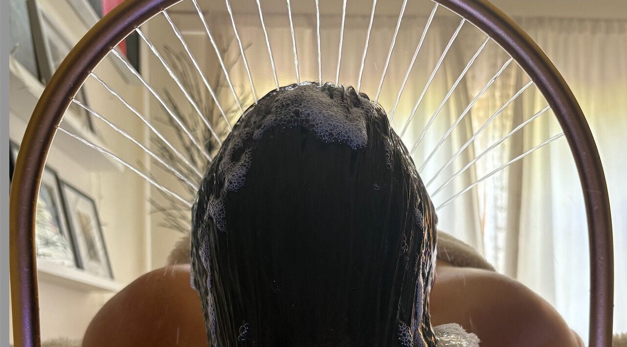 Relaxing hair wash experience at Glow Beauty, Elgin, Scotland, GB. A soothing moment of self-care and wellness.