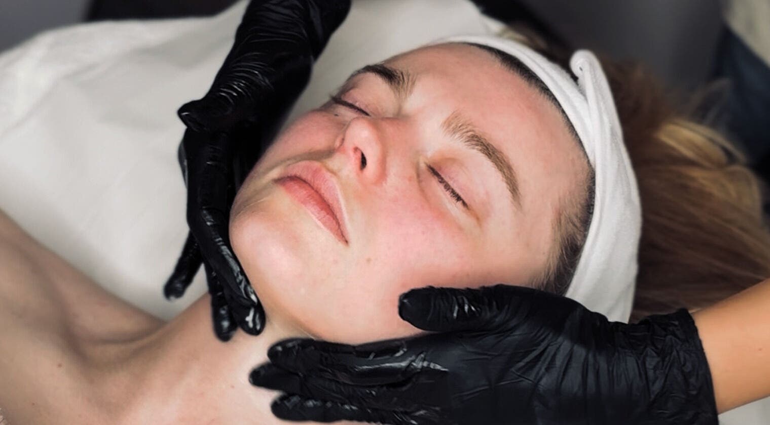 Relaxing facial treatment at Glow Beauty, Elgin, Scotland, GB with expert care and a serene ambiance.