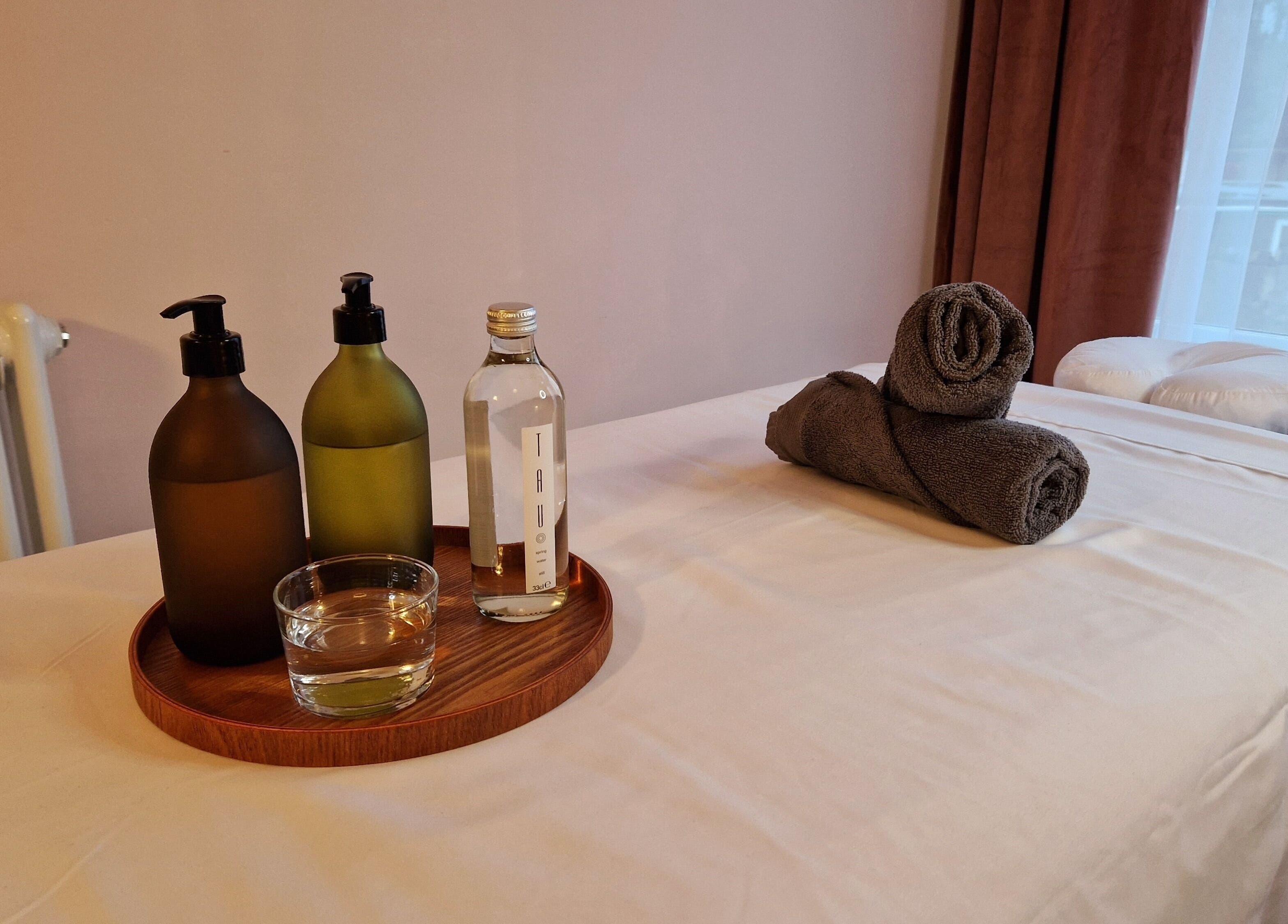 Massage table at Ailennyn | Rekindle Mobile Massage Therapy in Cardiff, Wales, GB set with oils and towels.
