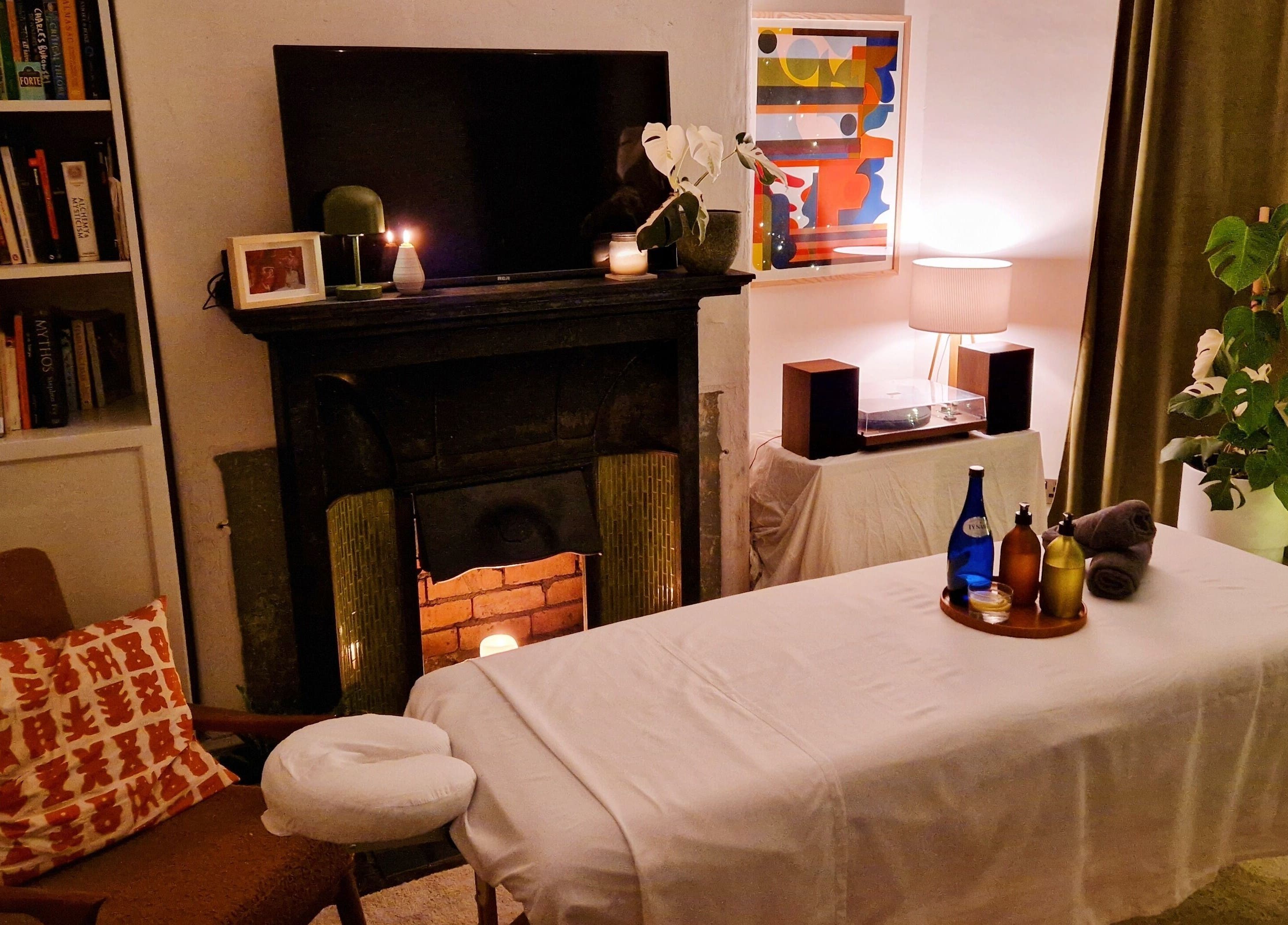 Relaxing massage setup at Ailennyn | Rekindle Mobile Massage Therapy, Cardiff, Wales, GB with soothing lighting.
