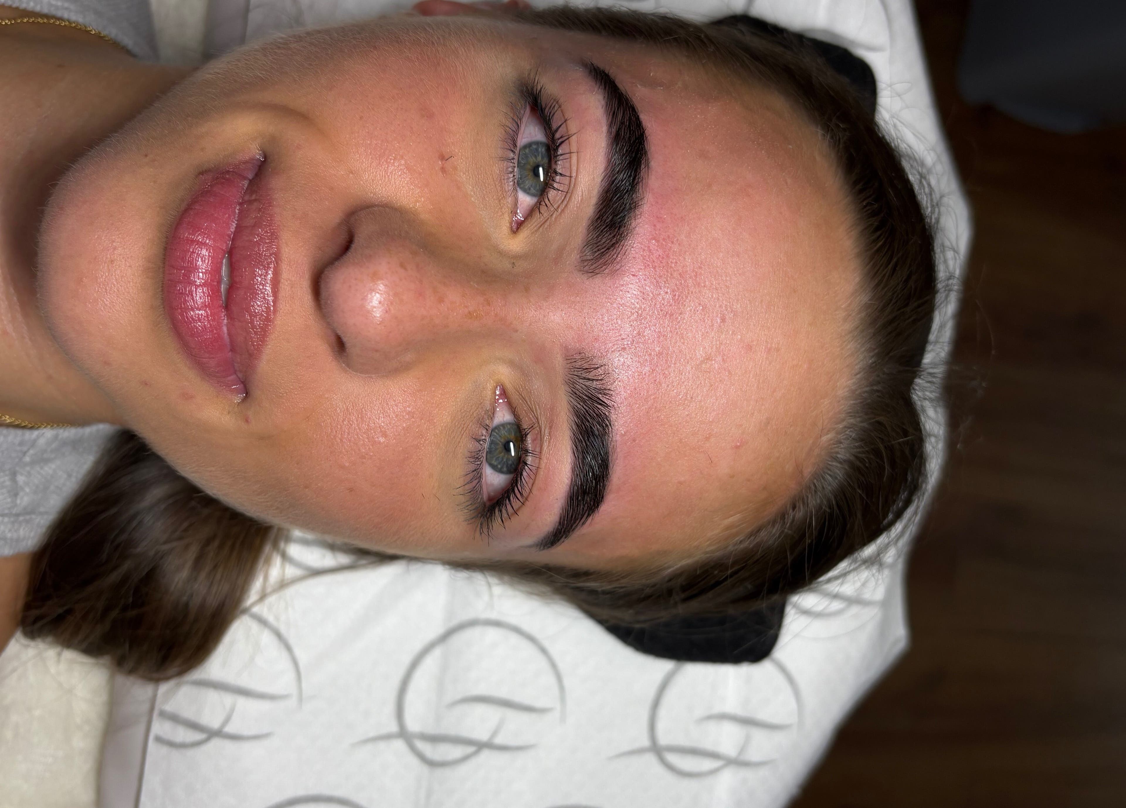 Close-up of a woman's perfectly groomed eyebrows after treatment at The Glow Up Club, Brough, England, GB.