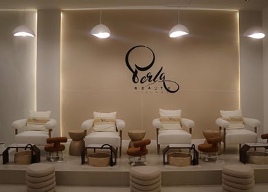 Luxurious pedicure chairs at Perla Beauty Lounge in Ras Al Khaimah, AE offer comfort and style.