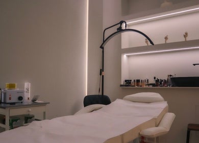 Serene treatment room at Perla Beauty Lounge, Ras Al Khaimah, AE featuring a comfortable massage bed and ambient lighting.