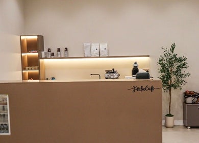 Chic cafe counter at Perla Beauty Lounge, Ras Al Khaimah, AE, inviting ambiance with warm lighting.