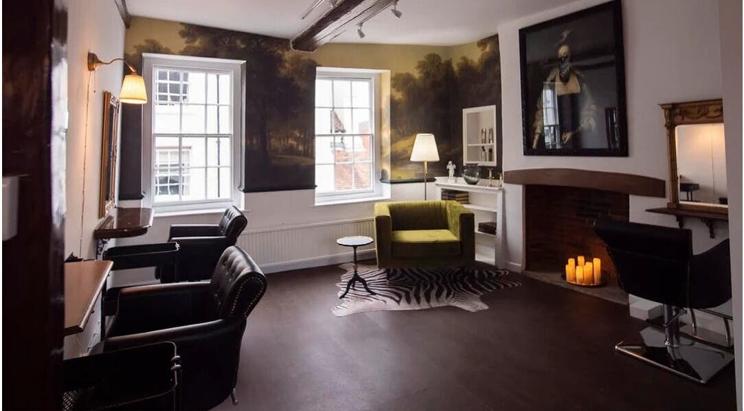 Chic and cozy salon space at Jack & the Wolfe, Lymington, England, GB, featuring stylish chairs and ambient lighting.