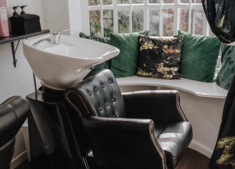 Elegant hair wash station at Jack & the Wolfe, Lymington, England, GB with plush seating and stylish decor.
