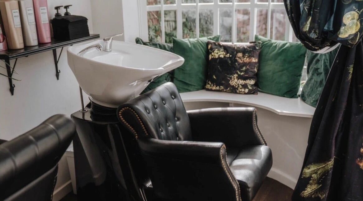 Elegant hair wash station at Jack & the Wolfe, Lymington, England, GB with plush seating and stylish decor.